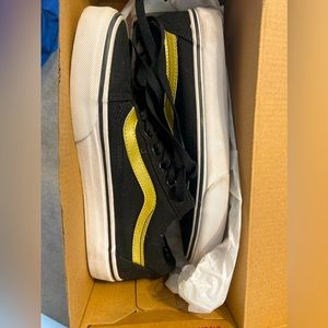 Black and gold vans